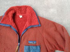 For sale is a vintage Patagonia Reverse Pile fleece jacket.  This jacket is in good gently used condition with holes or stains, part of the velcro seam on the chest pocket is loose but the velcro is intact and functional (see pictures).  Nice thick material, hand pockets and a chest pocket, rare and hard to find.   Patagonia, 100% Polyester and Nylon trim, Large, made in USA.  Thanks!   pit to pit: 23.5   length: 28  arm from center of collar: 34 Hip Hop Street Fashion, Mountain Gear, Hiking Winter, Fishing Jacket, Vintage Patagonia, Orange Jacket, Snow Fashion, Rap Tee, Zipper Jacket