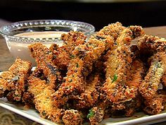 fried food on a plate with dipping sauce