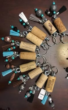 a bunch of wine corks are arranged in a circle on a table with beads and charms