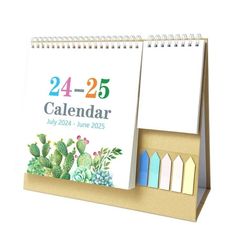 a desk calendar sitting on top of a cardboard box