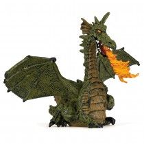 a green dragon figurine sitting on top of a table