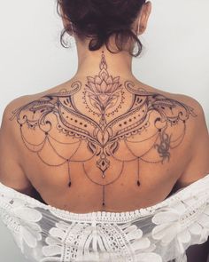 a woman with a tattoo on her back