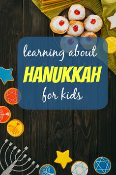 the words learning about hanukkah for kids on a wooden table