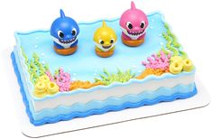 a cake with three little sharks on it