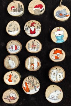 twelve hand painted wooden ornaments with animals on them