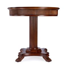 a wooden table with an oval shaped top and pedestals on the base, inlaid to