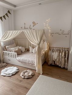 a baby's room decorated in white and gold