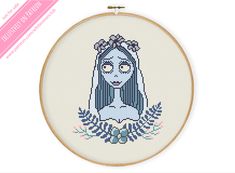 a cross stitch pattern with an image of a woman