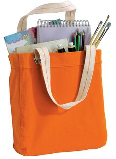 an orange tote bag filled with school supplies