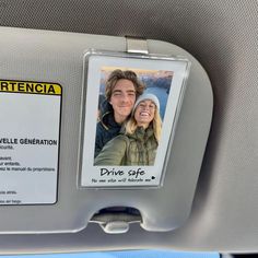 an id badge is attached to the back of a car seat with a photo of a man and woman