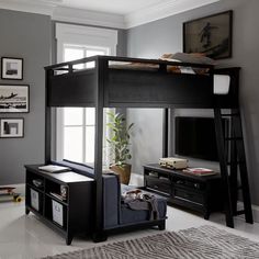 a loft bed with a desk underneath it in a room that has gray walls and white floors