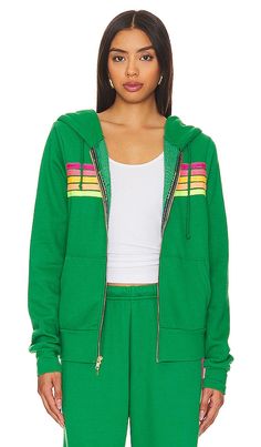 Find AVIATOR NATION X 5 Stripe Hoodie In Green on Editorialist. Aviator Nation X REVOLVE 5 Stripe Hoodie in Green. - size L (also in M, S, XL, XS) Aviator Nation X REVOLVE 5 Stripe Hoodie in Green. - size L (also in M, S, XL, XS) 50% polyester 38% cotton 12% rayon. Made in USA. Machine wash. Front zipper closure. Drawstring hood. Side slant pockets. Fleece lining. Item not sold as a set. ANAT-WK86. HDRS5-KGRNPNKY. Who doesn't have an obsession with vintage clothing? Paige Mycoskie, creator of Av Green Hooded Jacket With Ribbed Cuffs, Green Hoodie Outerwear In Athleisure Style, Green Sweatshirt With Drawstring Hood, Green Athleisure Top With Drawstring Hood, Green Hooded Jacket With Drawstring For Sports, Green Athleisure Hooded Jacket For Winter, Green Spring Sweatshirt With Adjustable Hood, Green Athleisure Outerwear With Drawstring Hood, Green Sporty Hoodie With Adjustable Hood