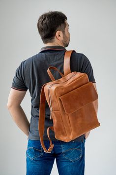 ● Large leather cognac backpack with big inside and outside pockets ● ● Large backpack is made by hand from genuine leather. Has three inner pockets and one large outer pocket with a flap. This backpack is suitable for both men and women. It can be used in everyday life for work, study, sports and travel. The backpack is made of high-quality genuine leather that guarantees its durable use.● ● Easily fits a 15.6 '' laptop in this backpack ● ● Unique leather over time gets better. A bag can be mad Cognac Backpack With Leather Backing For Travel, Cognac Leather-backed Backpack For Travel, Cognac Leather Backpack For Travel, Cognac Soft Leather Backpack For Travel, Cognac Leather Standard Backpack, Cognac Leather Travel Backpack, Daily Use Standard Backpack In Cognac, Cognac Leather Backpack, Functional Brown Backpack For Everyday Carry