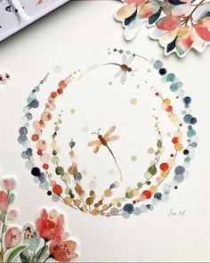 a watercolor painting with flowers and a dragonfly on it