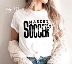 a woman wearing a t - shirt that says, mascott soccer on the front