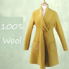 "*Slightly fitted coat made of 100% boiled wool with a special shawl collar. The boiled wool is knitted and therefore slightly stretchy, making it comfortable to wear. With the extended shawl collar, the jacket closes in different ways.The item is unlined.  All inner and outer seams are finished with a handcrafted cocotte stitch. With this design we have strived for a garment which is easy to recycle: on the way to a waste- free society where everything is recyclable or at least biodegradable we Fitted Wool Coat With Shawl Collar For Fall, Cashmere Outerwear With Shawl Collar For Winter, Cashmere Shawl Collar Outerwear For Winter, Fall Wool Coat With Shawl Collar, Wool Sweater Coat With Shawl Collar For Work, Merino Wool Sweater Coat With Shawl Collar For Winter, Cozy Long Wool Sweater Coat, Winter Cashmere Wrap Outerwear, Wool Sweater Coat With Shawl Collar For Winter