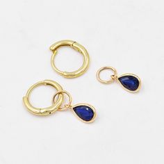 Blue Sapphire charms for earrings (Pair) ✪Gemstone: Natural Blue Sapphire ✪Metal: 18k solid yellow gold. ✪Stone size: 6x4 mm. ✪Stone Shape : Pear ✪Stone Weight : 1 Ct. ✪ Charm Weight : 0.560 Gram ✪Charm + Hoop Weight : 1.560 Gram Approx. ✪Charm Length : 13 mm. ✪Charm width : 5 mm. ✪Bail size inside : 4 mm. ✪Fit Up To 3.5 mm Wide Hoops. ✪Hoop Size inside : 8 mm. ✪Hoop Width : 1.5 mm ✪Setting type: Bezel wire setting. If you need any other preferred stone please contact us. Sapphire benefits - *The result is a good gain of self-confidence and mental       balance. Surprisingly, blue Sapphire also has some health benefits.  *Wearing the Neelam/Blue Sapphire aids in digestion too.  *Having a direct impact on wealth, the Blue Sapphire (Neelam)stone can cause a boost in finances. QUALITY OF MATE Gemstone Dangle Huggie Earrings Gift, Gold Hoop Earrings With Birthstone - Fine Jewelry, Gold Hoop Earrings With Birthstone, Yellow Gold Dangle Hoop Earrings With Gemstones, Gift 14k Gold Hoop Earrings With Gemstone, 14k Gold Filled Birthstone Hoop Jewelry, 14k Gold Hoop Earrings With Gemstone For Gift, 14k Gold Hoop Earrings With Gemstones As A Gift, Gold-plated Gemstone Hoop Earrings Gift