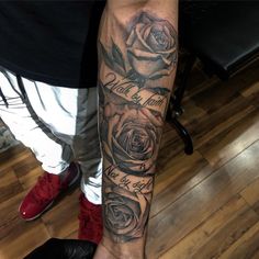 a man with a rose tattoo on his arm