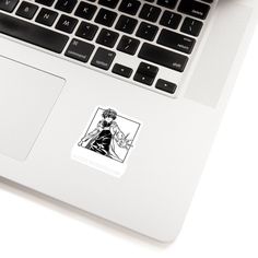 an open laptop computer sitting on top of a white desk