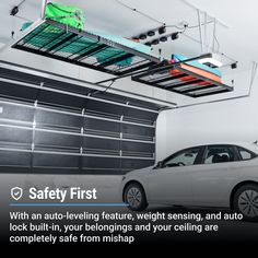 a car parked in front of a garage door with safety first written on the side