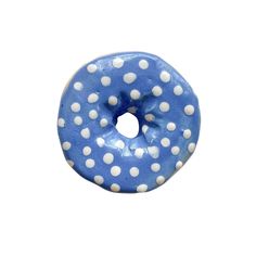 a blue donut with white polka dots on it