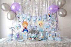 the table is set up for a frozen princess birthday party