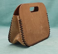 a wooden purse sitting on top of a table