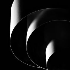 black and white photograph of three circular objects