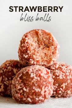 a pile of strawberry bliss balls sitting on top of each other