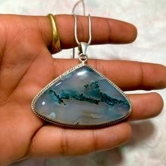 "Moss Agate // Moss Agate Pendant // Handmade Necklace // 925 Sterling Silver // Necklace Jewelry // Shape Heart // Size 54x34 MM Without Chain weight = 24.11 gm With Chain Weight = 31.47 gm Shape = Heart Size = 24x34 mm Moss agate is a semi-precious gemstone formed from silicon dioxide. It is a form of chalcedony which includes minerals of a green color embedded in the stone, forming filaments and other patterns suggestive of moss.[1] The field is a clear or milky-white quartz, and the included Silver Moss Agate Necklaces As Gift, Silver Moss Agate Necklaces For Gifts, Silver Moss Agate Necklace As A Gift, Handmade Silver Chalcedony Necklace, Chalcedony Jewelry With Large Stone For Gift, Chalcedony Necklace With Large Pendant For Gift, Moss Agate Cabochon Necklace For Gift, Large Agate Stone Gemstone For Gift, Silver Moss Agate Necklace