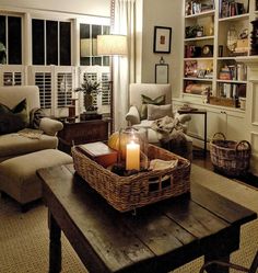 a living room filled with furniture and a candle