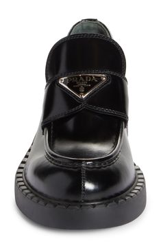 Prada's iconic triangular logo shines on a polished patent-leather loafer tastefully updated with a ridged sole and a welt resembling tiny chocolate bars. 1 1/2" (38mm) heel; 3/4" platform (size 8.5US/38.5EU) Leather upper and lining/rubber sole Made in Italy Women's Designer Shoes Prada Triangle, Leather Loafers Women, Patent Leather Loafers, Platform Loafers, Chocolate Bars, Penny Loafer, Prada Men, Triangle Logo, Footwear Design Women