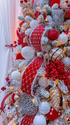 a christmas tree decorated with red and white ornaments