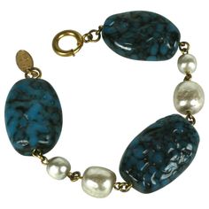 Miriam Haskell pate de verre and faux baroque pearl bracelet composed of three oversized faux lapis Gripoix glass handmade glass beads and two stations of large and medium alternating Miriam Haskell signature faux pearls. Excellent Condition, Signed. Length 7.75" x Width .75" Art Deco Pearl, Miriam Haskell Jewelry, Bracelet Art, Faux Pearl Bracelet, Vintage Green Glass, Miriam Haskell, Handmade Glass Beads, Handmade Design, Baroque Pearls