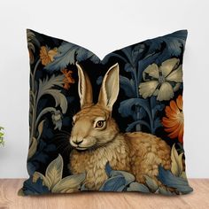 a decorative pillow with an image of a rabbit on it