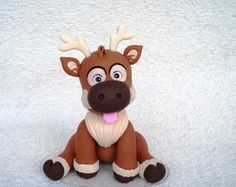 a brown and white toy sitting on top of a floor