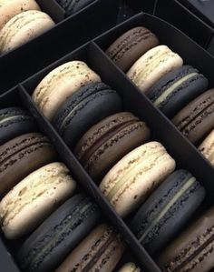 an open box filled with lots of different colored macaroons