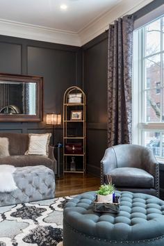 a living room filled with furniture and a chandelier