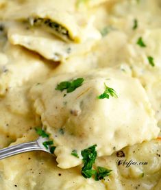 a close up of a spoon with some food on it