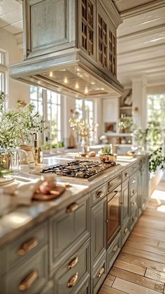 a kitchen filled with lots of counter top space next to a stove top oven and sink