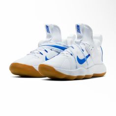 a pair of white and blue sneakers on a white background with the word nike written in blue