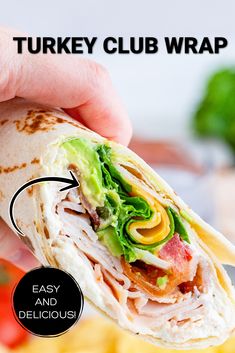 Half of a turkey club wrap being held in the air. Club Wraps Turkey, Turkey Ranch Club Wrap, California Turkey Club Wrap, Turkey And Cheese Wraps Healthy Lunches, California Turkey Wrap, Turkey Ham Wraps, Turkey And Ham Wraps, Wraps Recipes Ham, Turkey Ranch Wrap