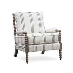 an upholstered chair with wooden legs and striped fabric on the armrests