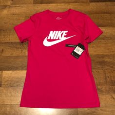 Nwt!! Nike Printed Logo Women’s T-Shirt Soft 100% Cotton Standard Fit Size: Xs (True To Size) Color: Bright Pink Measurements: Chest: 16.5” (Armpit To Armpit) Nike Sporty Top With Logo, Sporty Nike Top With Logo, Casual Pink Tops With Logo, Logo Women, Tops Nike, Nike Shirt, S Logo, Bright Colored, Print Logo