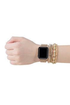 a woman's arm with an apple watch on it and bracelets around her wrist