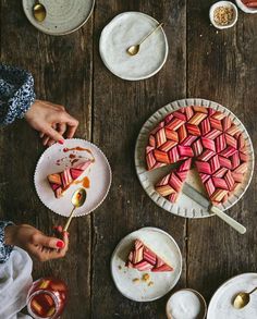 people are eating desserts on plates with spoons