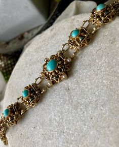 Circa 1940s Beautiful Austro Hungarian Persian Turquoise Pearl Gold Gilt Sterling Silver vintage bracelet Austro Hungarian Jewelry Bracelet measures 7 inches long Check out or Art & Antiquities Gallery on our sister Etsy site Vinmana See link Below - We are adding beautiful Objects daily https://www.etsy.com/shop/vinmana Victorian Turquoise Jewelry For Formal Occasions, Elegant Turquoise Bracelets With Cabochon, Ornate Turquoise Jewelry For Wedding, Ornate Turquoise Jewelry For Collectors, Vintage Turquoise Jewelry With Intricate Design, Victorian Turquoise Jewelry For Wedding, Victorian Turquoise Filigree Jewelry, Vintage Blue Jewelry With Jubilee Bracelet, Vintage Turquoise Bracelet