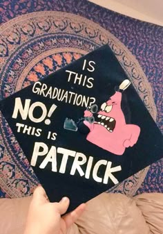 someone is holding up a graduation cap that says, is this graduation? no is patrick