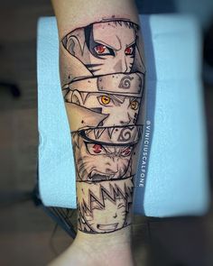 a man's leg with tattoos on it that has many different faces and eyes