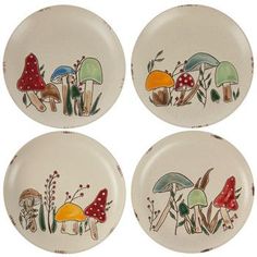 four plates with mushrooms painted on them